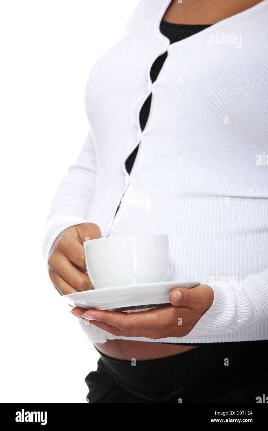 Pregnant woman holding cup of coffee Stock Photo - Alamy