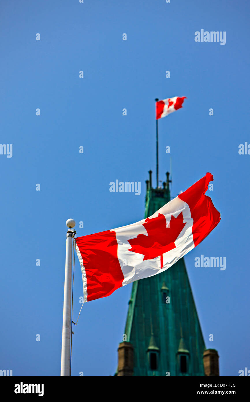 Peace Tower in the Centre Block of the Parliament Buildings and a Canadian National Flag, Parliament Hill, City of Ottawa Stock Photo