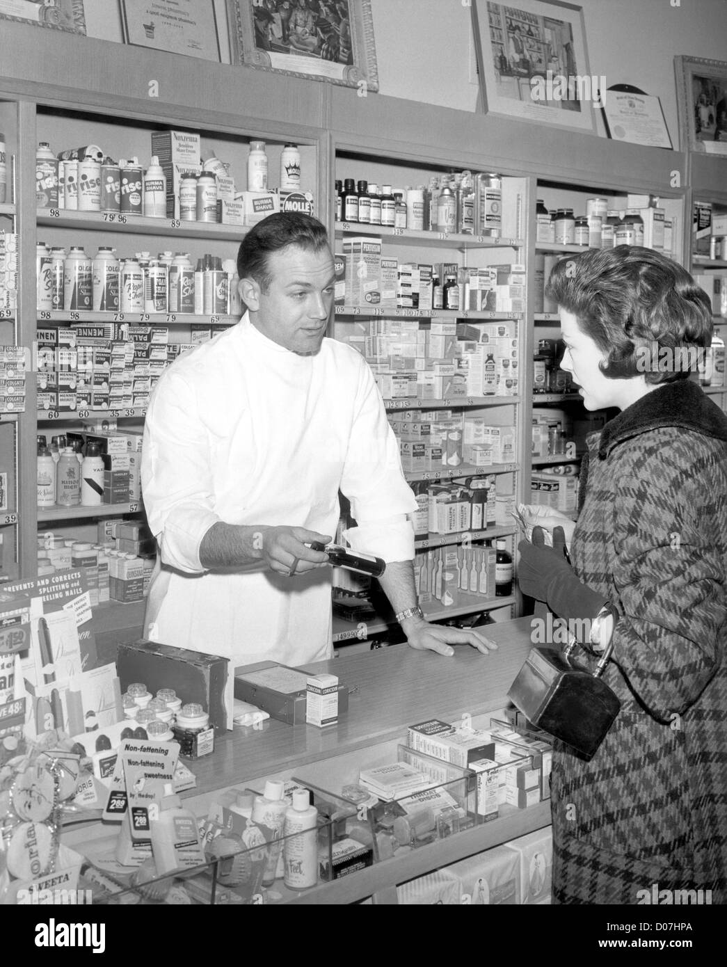 Woman consulting with pharmacist Stock Photo