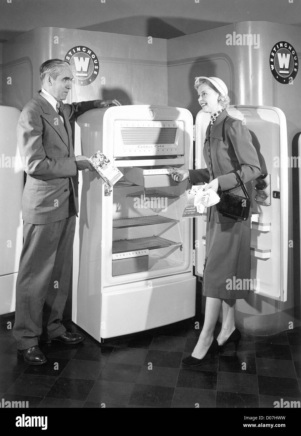 Woman shopping for refrigerator Stock Photo