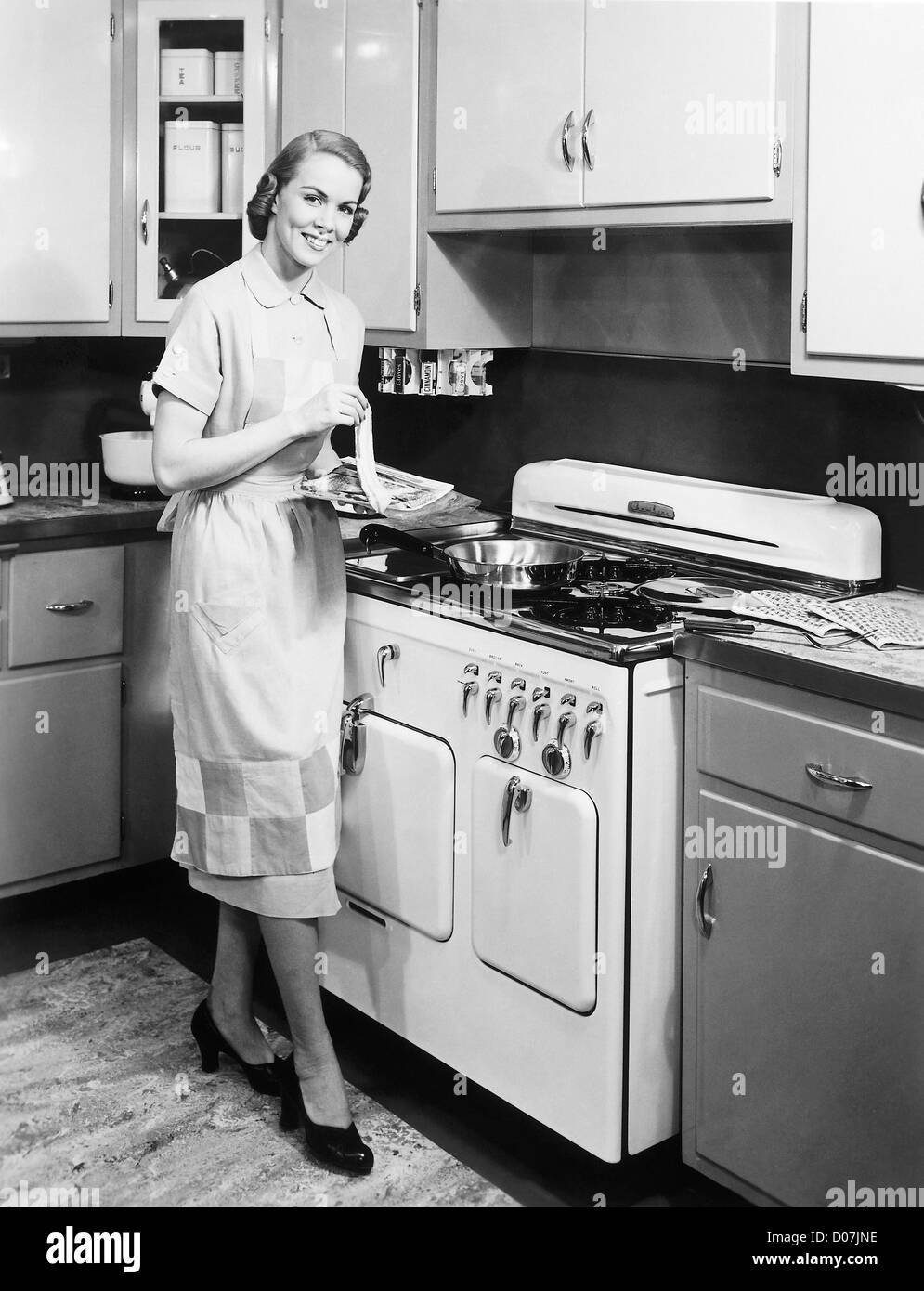 Woman preparing to cook bacon Stock Photo