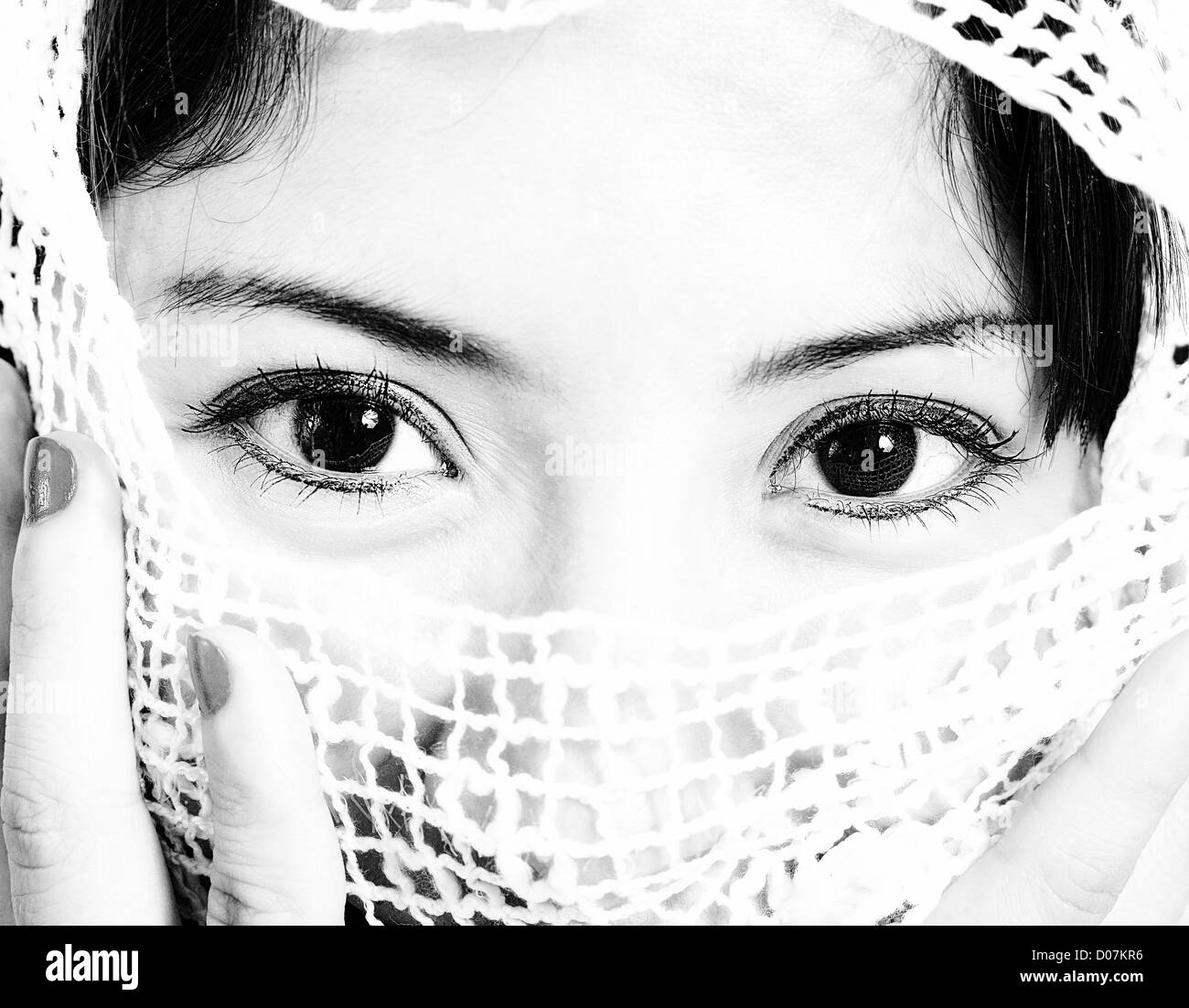 Muslim Woman With A White Veil In Front Of Her Face Stock Photo