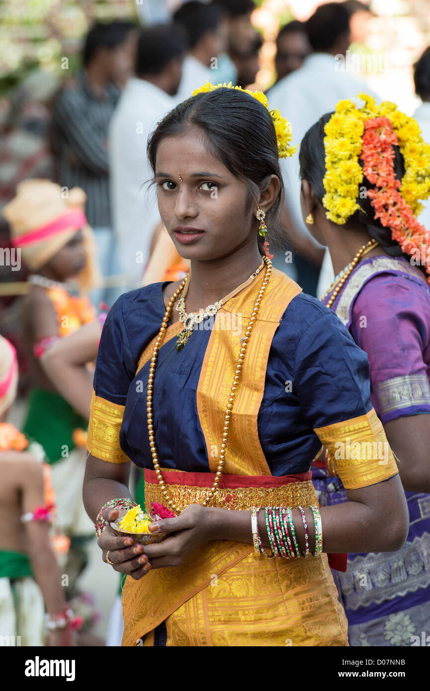 Indian girls in traditional dress dancing at a festival in the streets of Puttaparthi. Andhra Pradesh, India Stock Photo