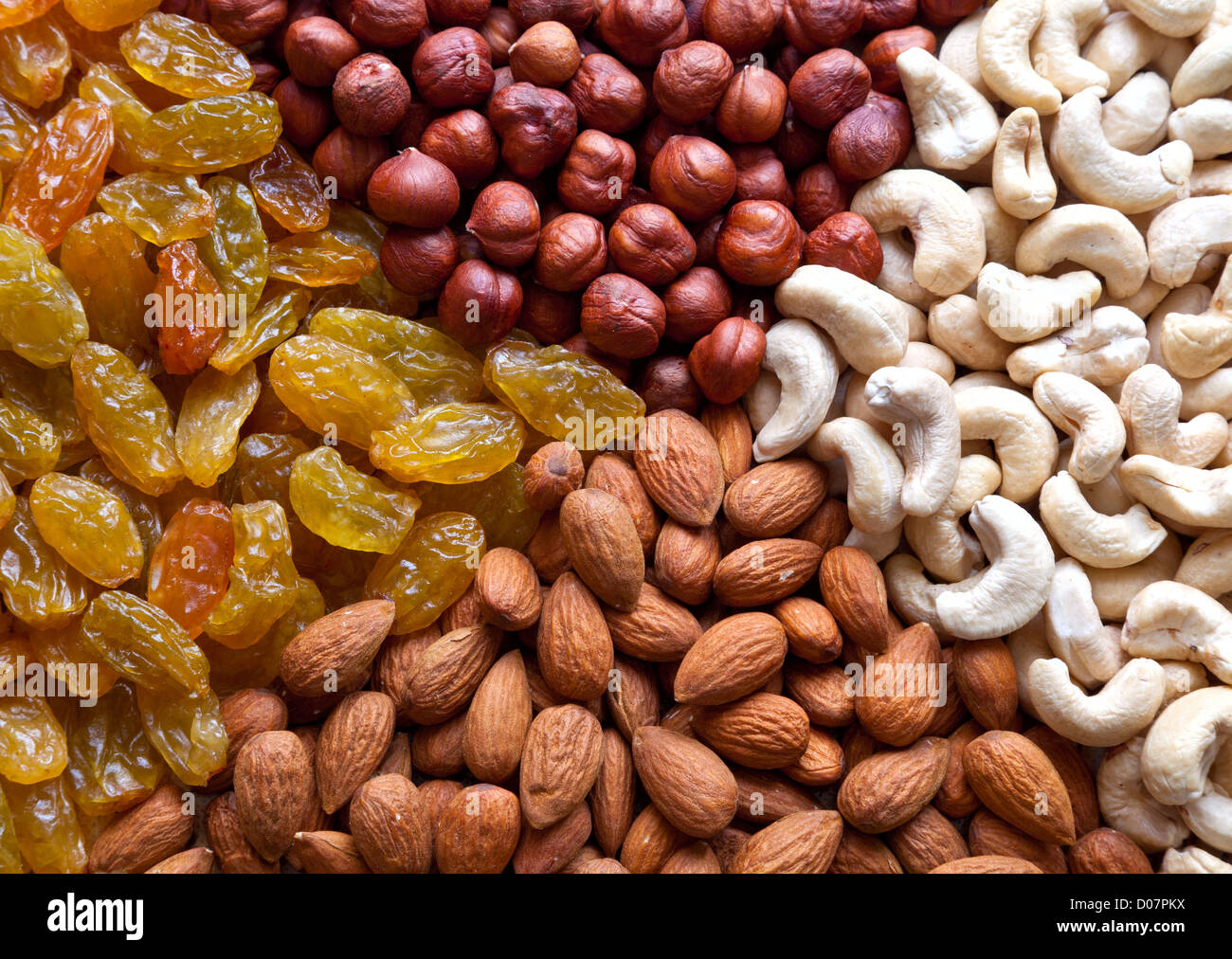 Four section of different nuts and raisins Stock Photo