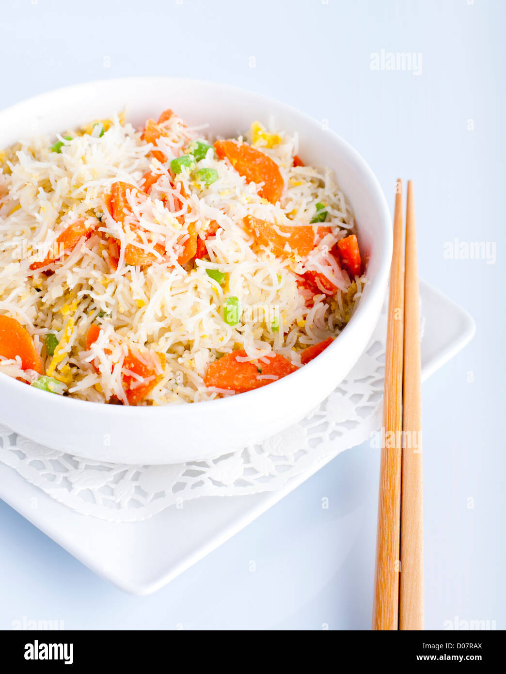 Asian fried rice noodles. Serve with chopsticks Stock Photo Alamy