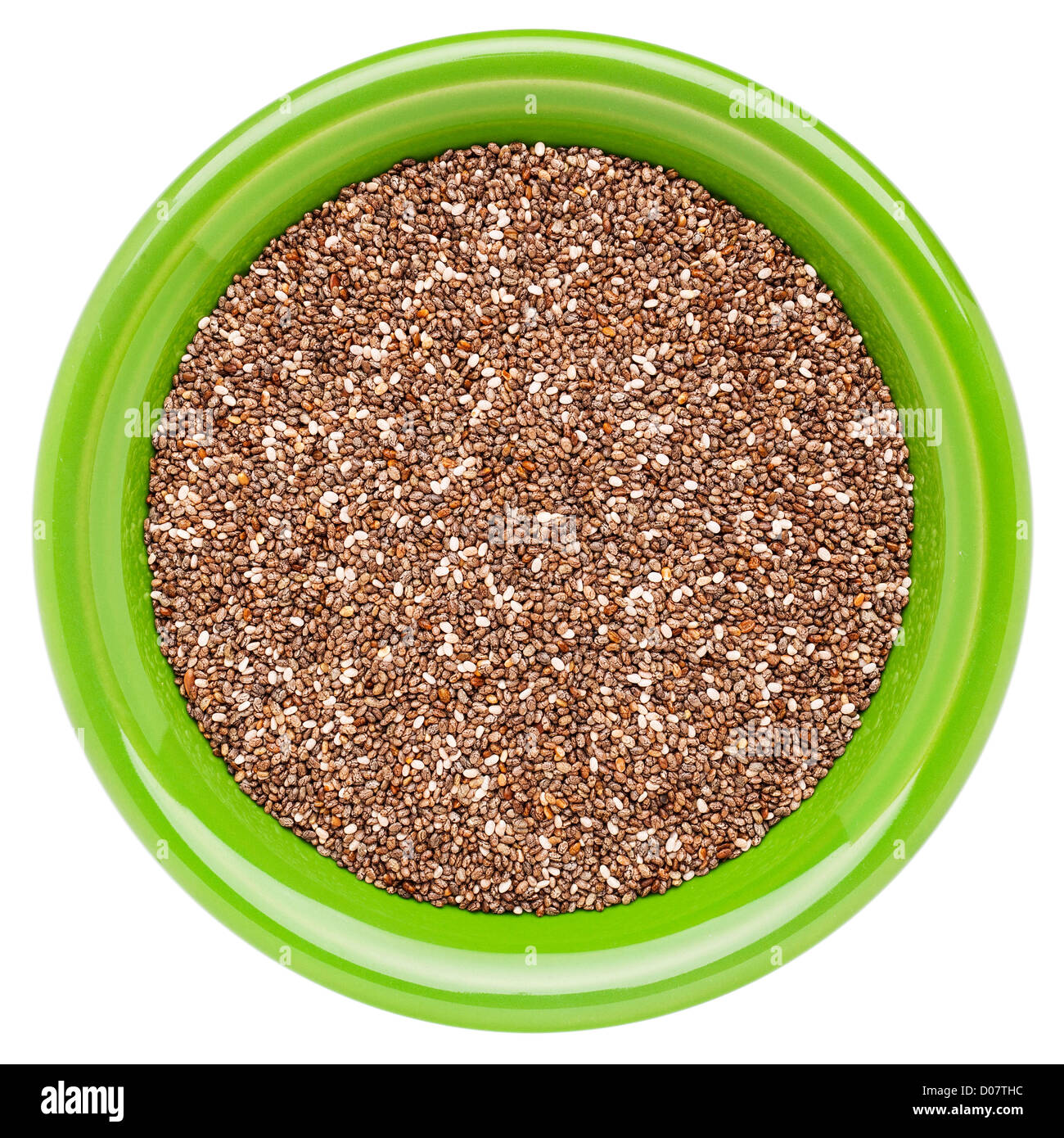 chia seeds in a green round ceramic bowl isolated on white Stock Photo