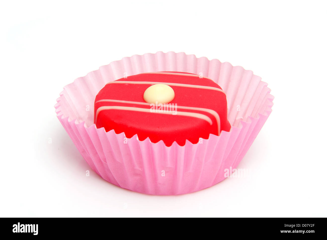 delicious pink petit four over white background Stock Photo