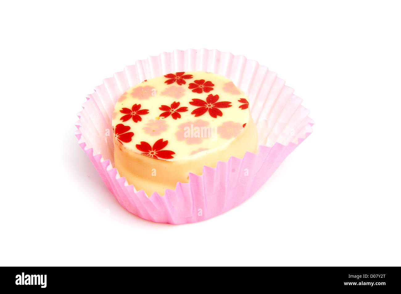 Delicious petit four, little cake over white background Stock Photo