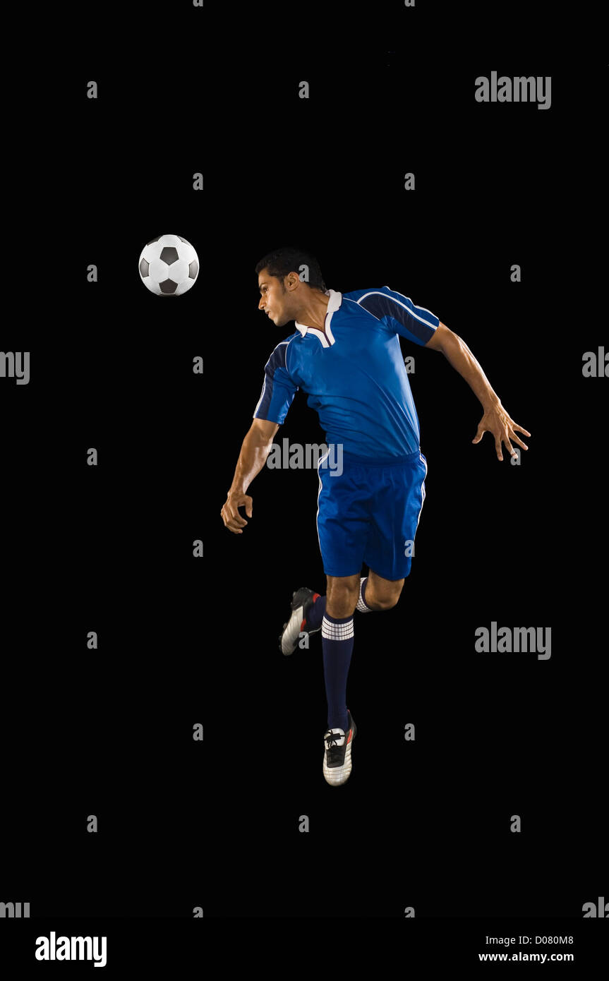 Man heading a soccer ball Stock Photo Alamy