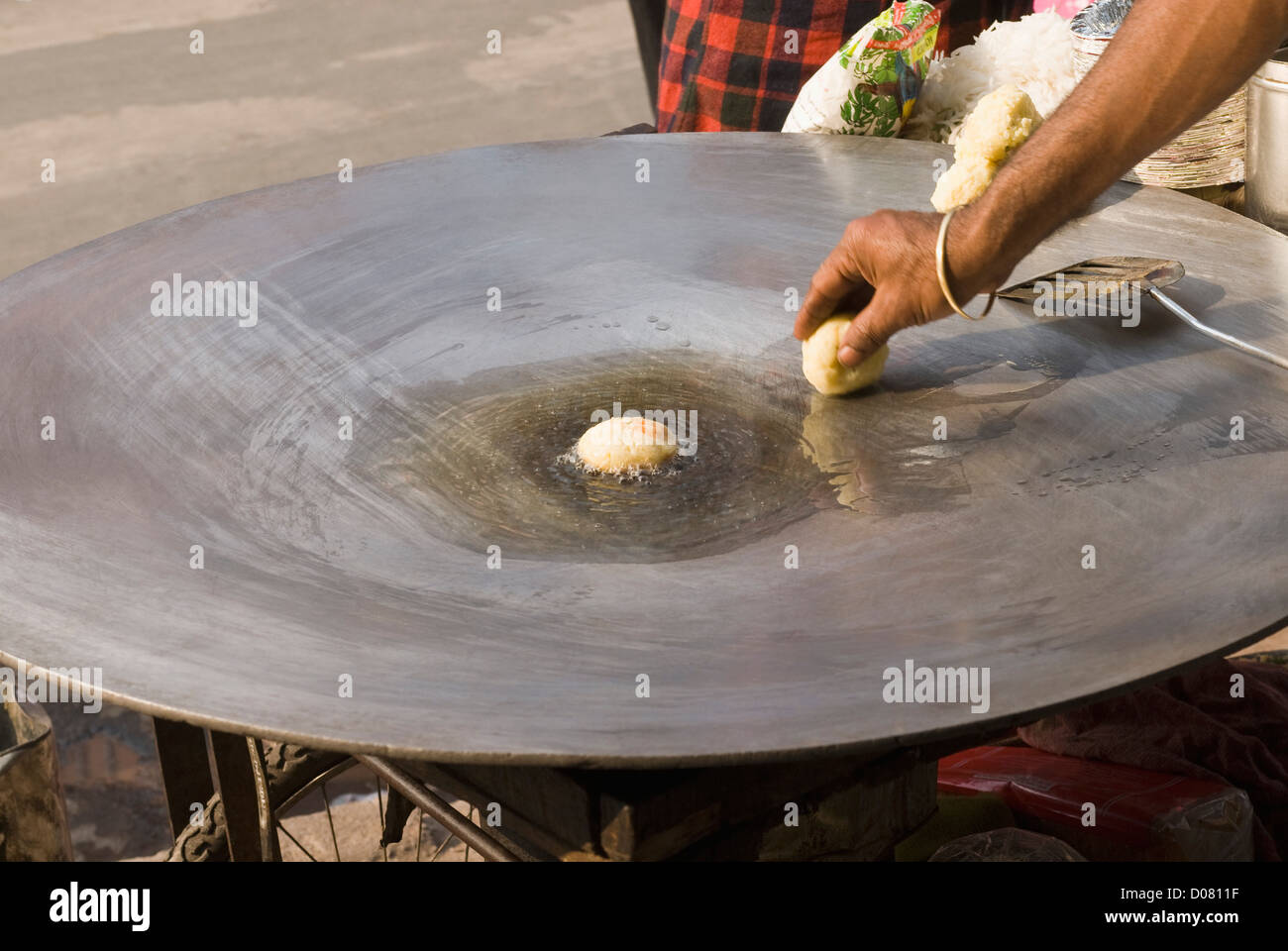 Man frying aloo tikki on a griddle, Delhi, India Stock Photo Alamy