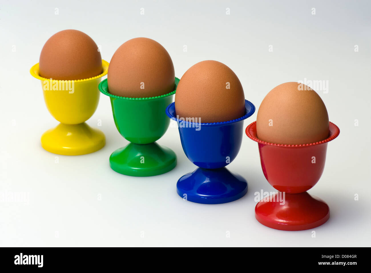Diagonal colourful egg cups Stock Photo