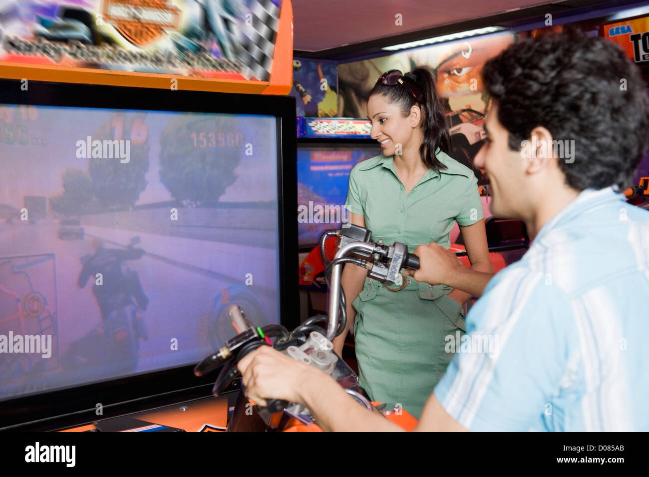 Woman playing video games indian hi-res stock photography and images ...