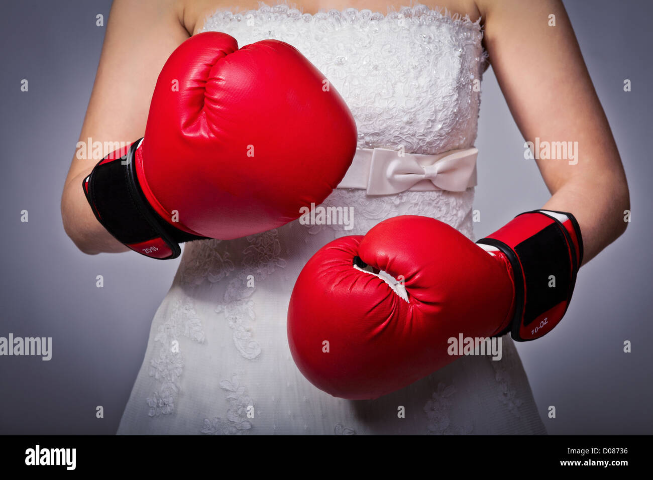 detail of bride wearing boxing gloves Stock Photo