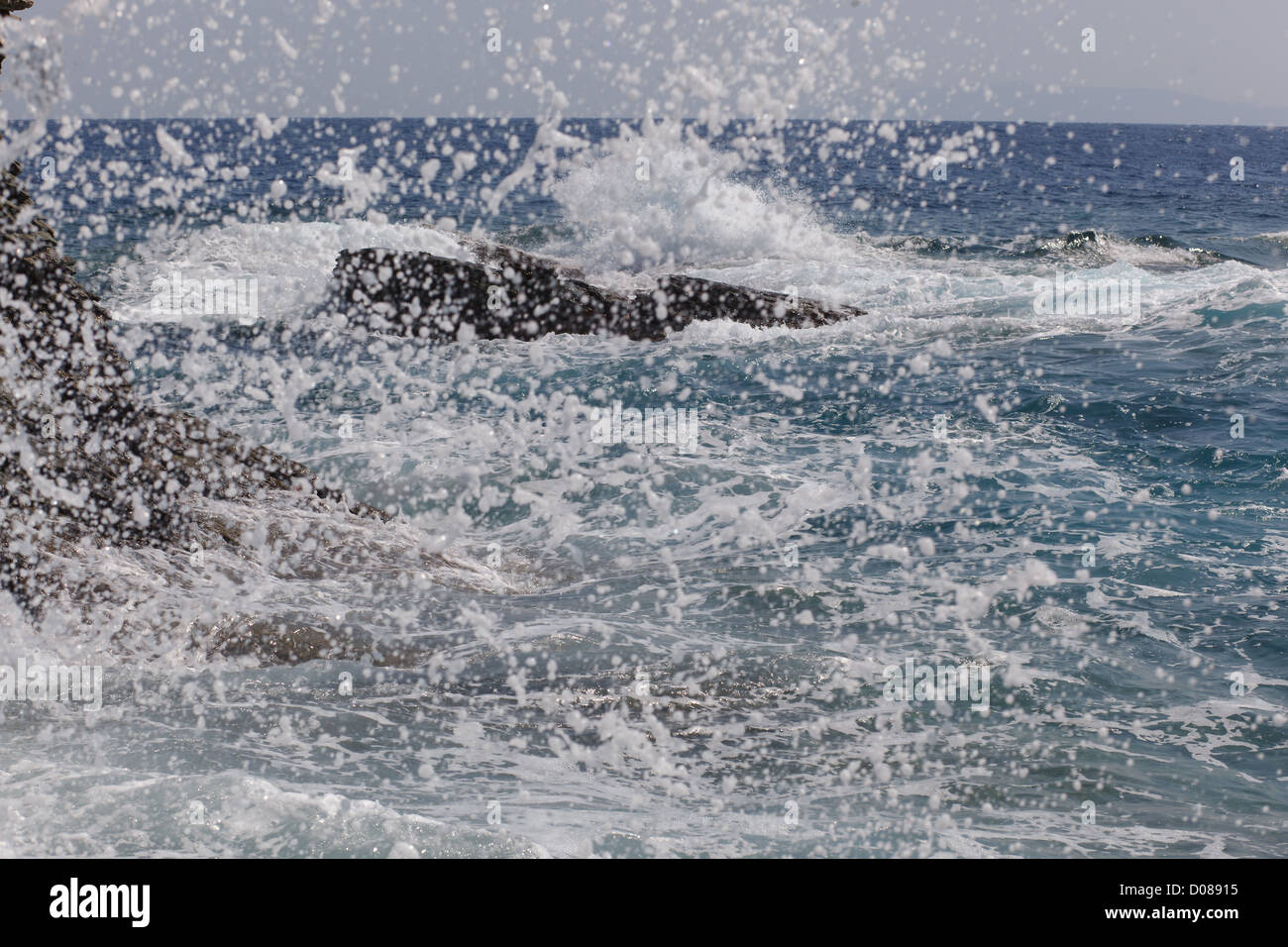 Storm at the sea with splashes of water Stock Photo - Alamy