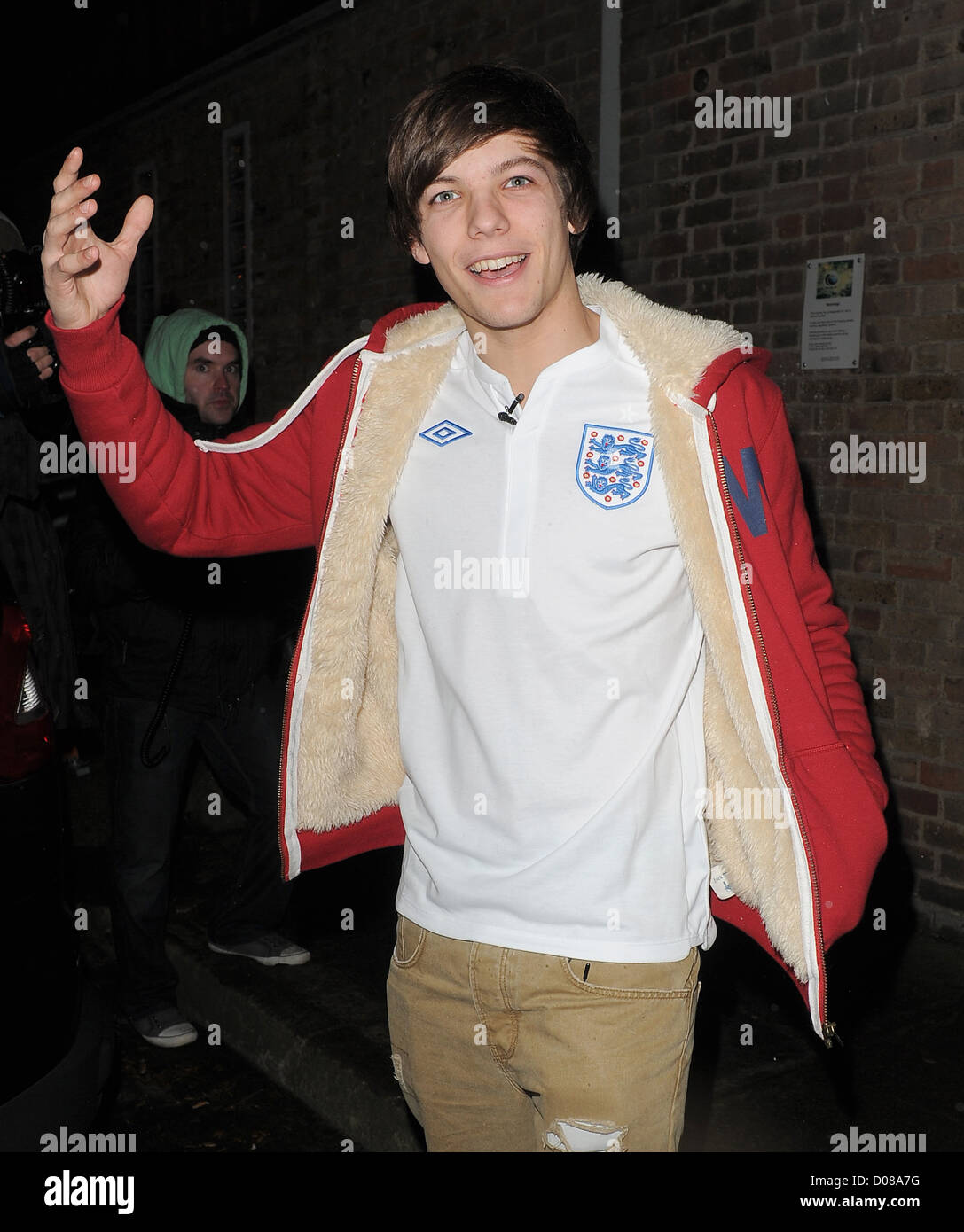X Factor finalist Louis Tomlinson from boy band One Direction leaving a  studio wearing an England football shirt, in Stock Photo - Alamy