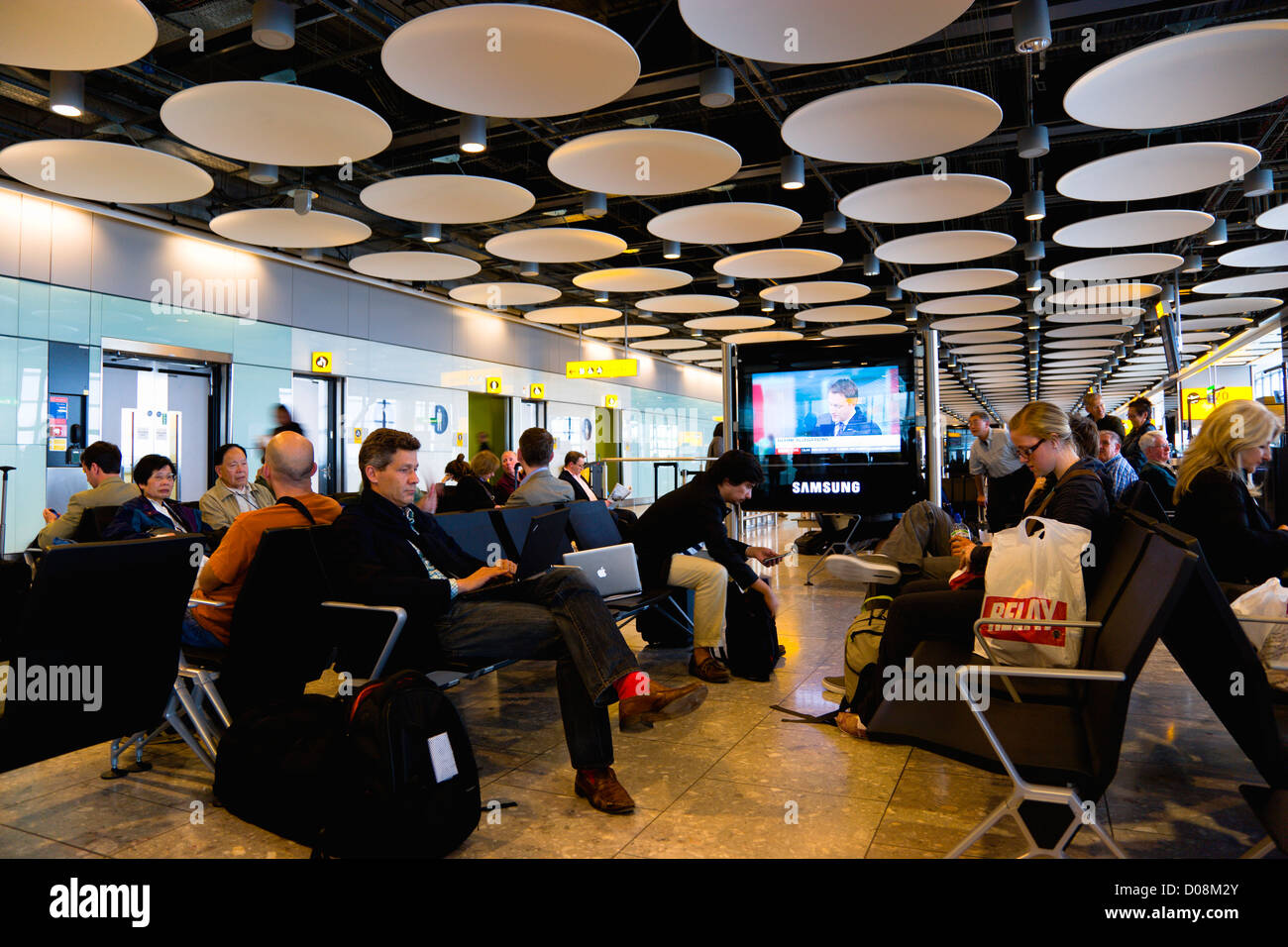England, London, Heathrow Airport Terminal 5 disc ceiling in departures