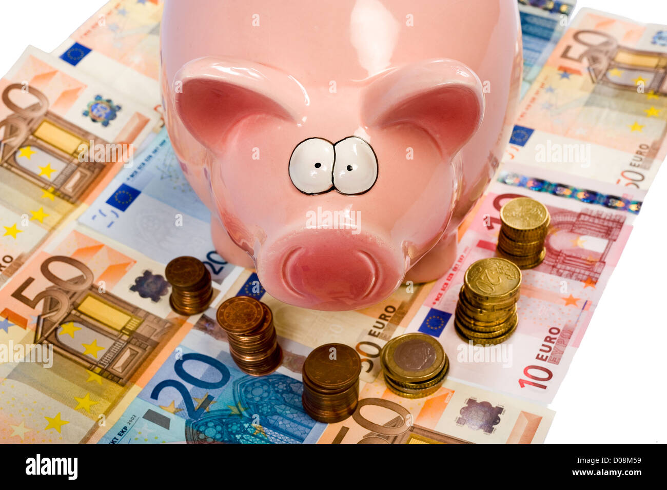 A saving pig is standing on euro paper money Stock Photo