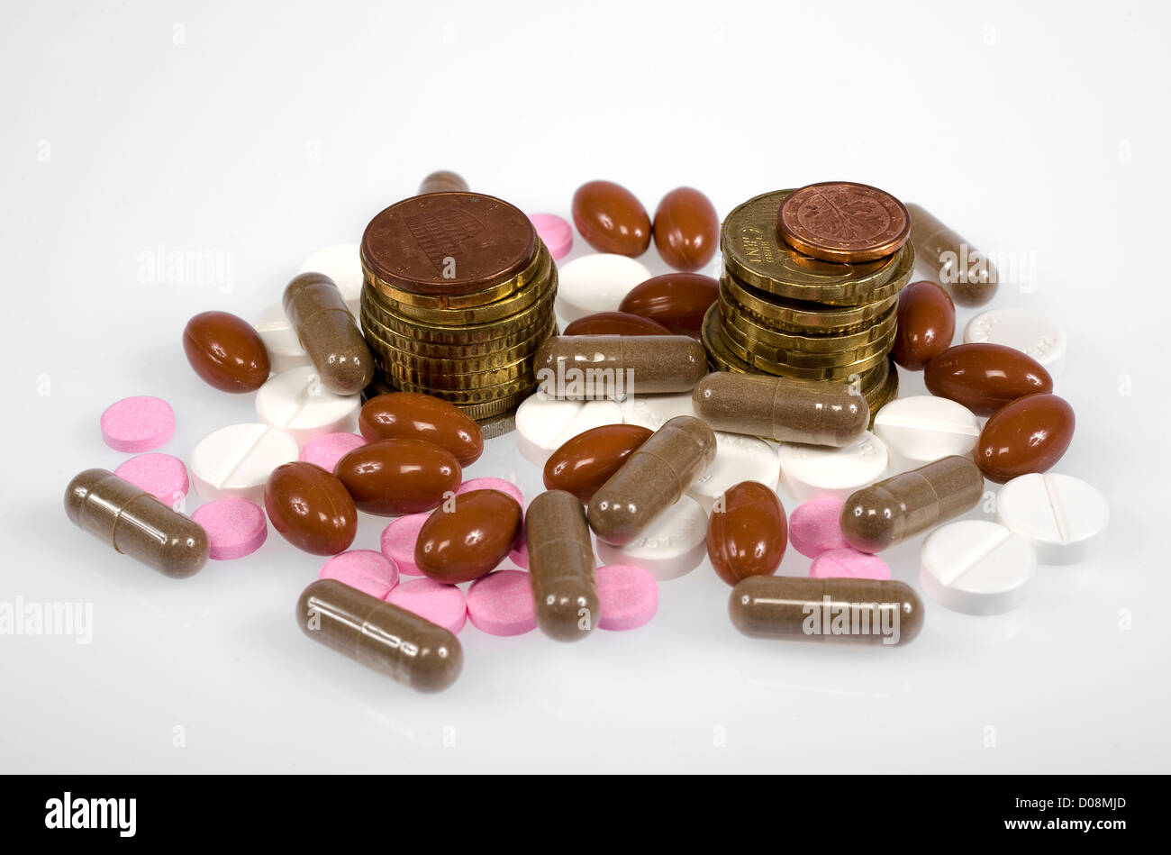 Euro coins between pills and medicines Stock Photo