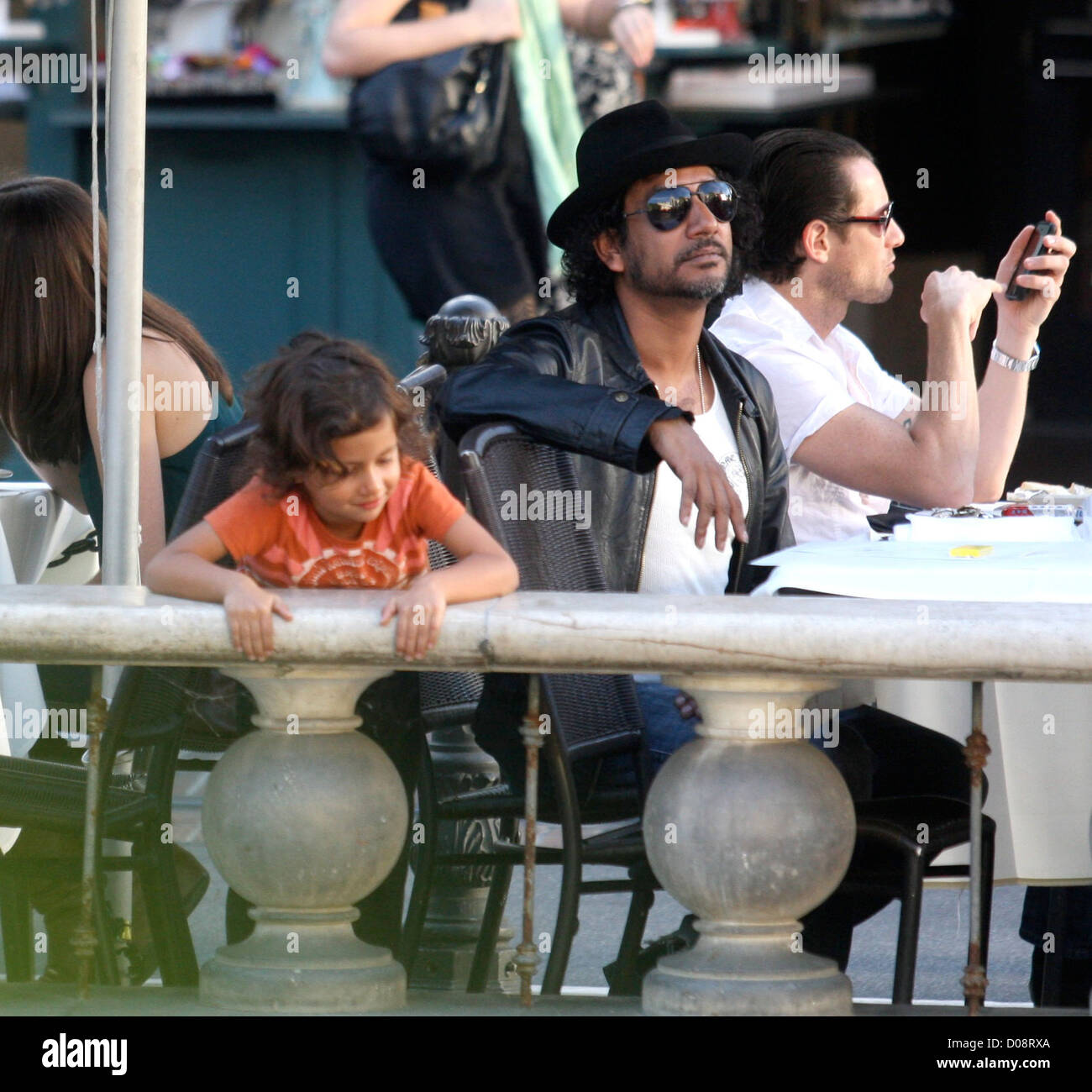 Naveen Andrews enjoys lunch with his friend and their children at