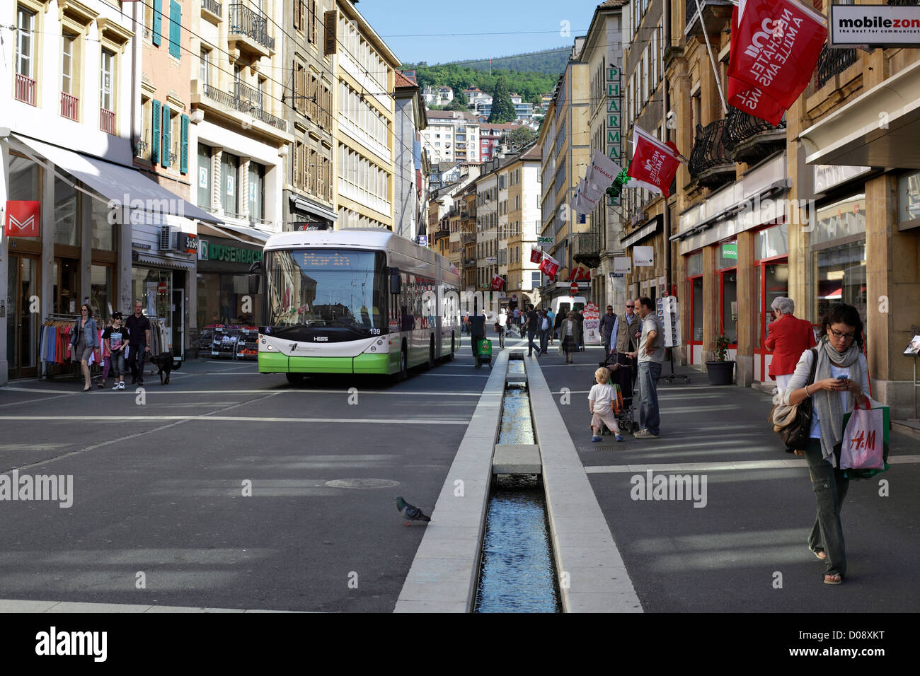 A modern trolleybus in the otherwise pedestrianised Rue du Seyon, in the centre of Neuchatel, Switzerland. Stock Photo