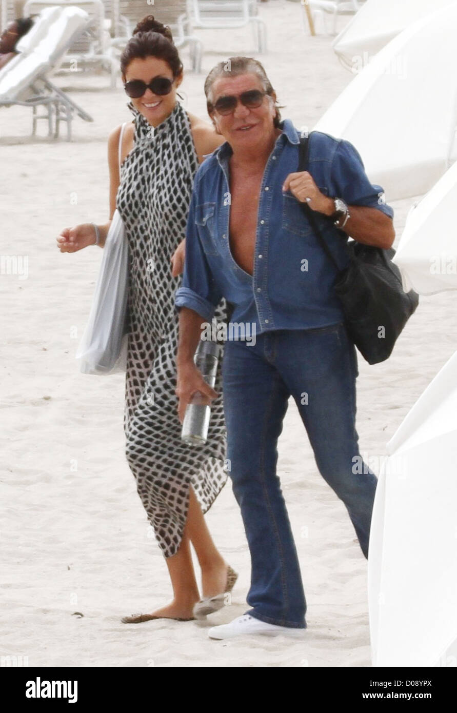 Italian fashion designer Roberto Cavalli and a friend enjoying the sunshine  while on holiday on Miami Beach Miami Florida Stock Photo - Alamy