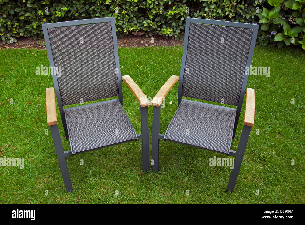 Two chairs in the garden Stock Photo Alamy