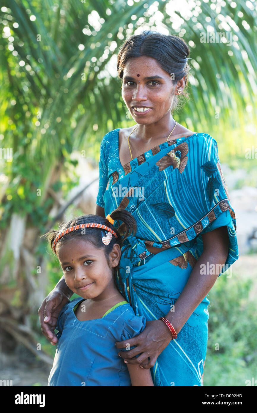 Smiling happy rural Indian village girl and her mother. Andhra Pradesh ...