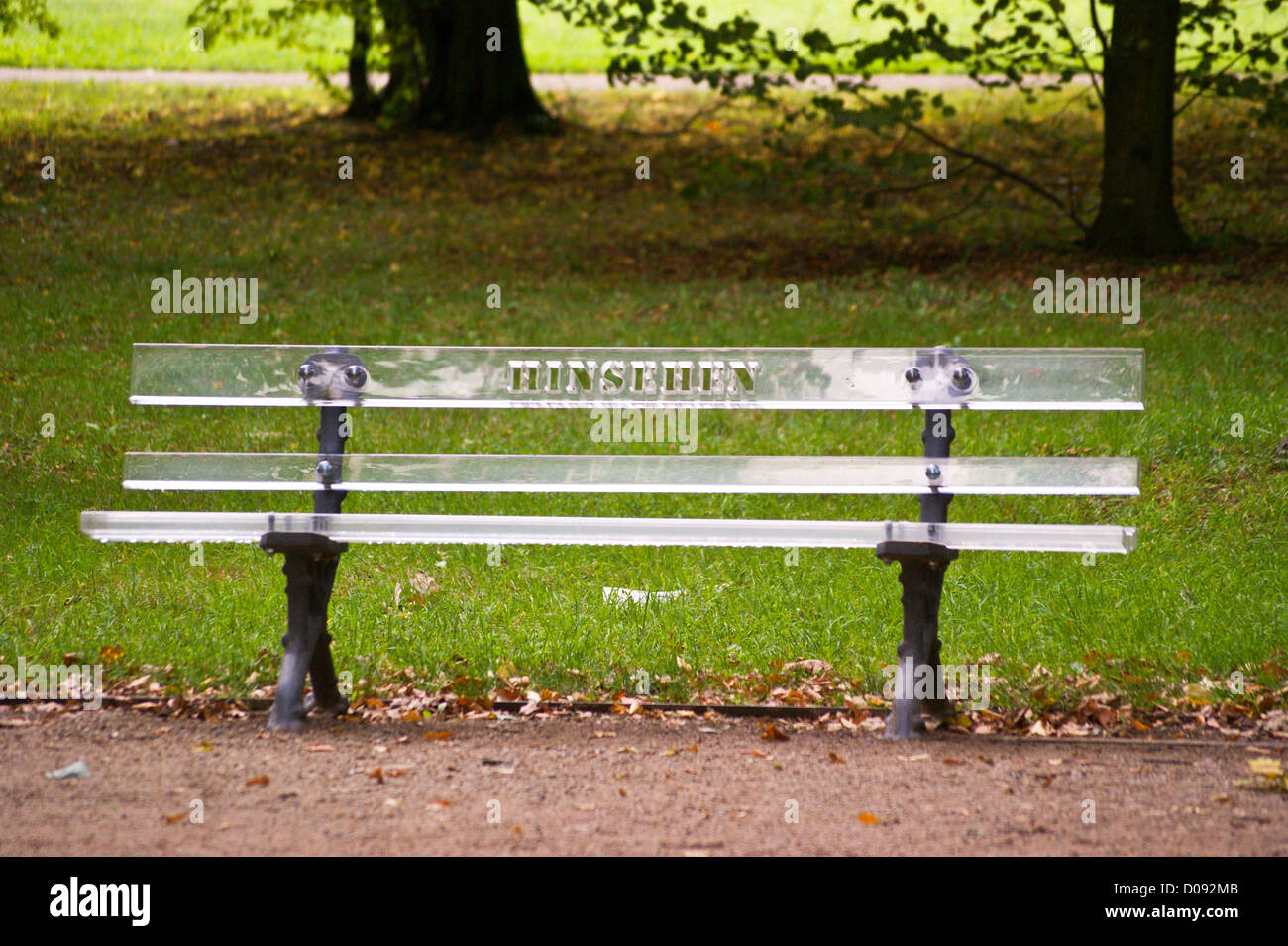 A perspex park bench with the word 'Hinsehen' ('Look'), by Marion Kahnemann, Grosser Garten Dresden, Sachsen, Saxony, Germany Stock Photo