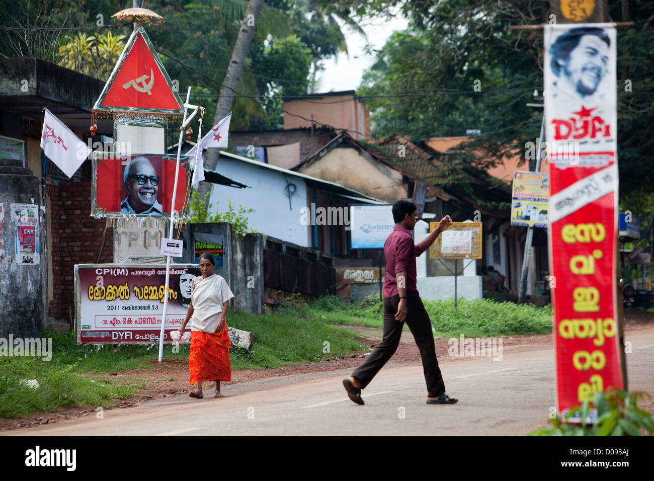 PROPAGANDA POSTER FROM THE KERALA COMMUNIST PARTY ON A STREET IN NEDUNGOLAM KERALA SOUTHERN INDIA ASIA Stock Photo