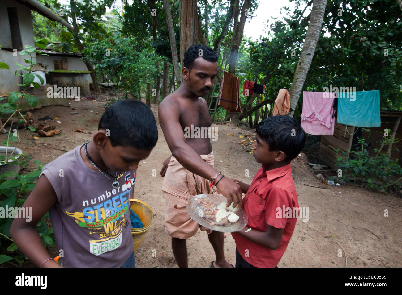 FAMILY MEAL IN A FARM NEDUNGOLAM KERALA SOUTHERN INDIA ASIA Stock Photo