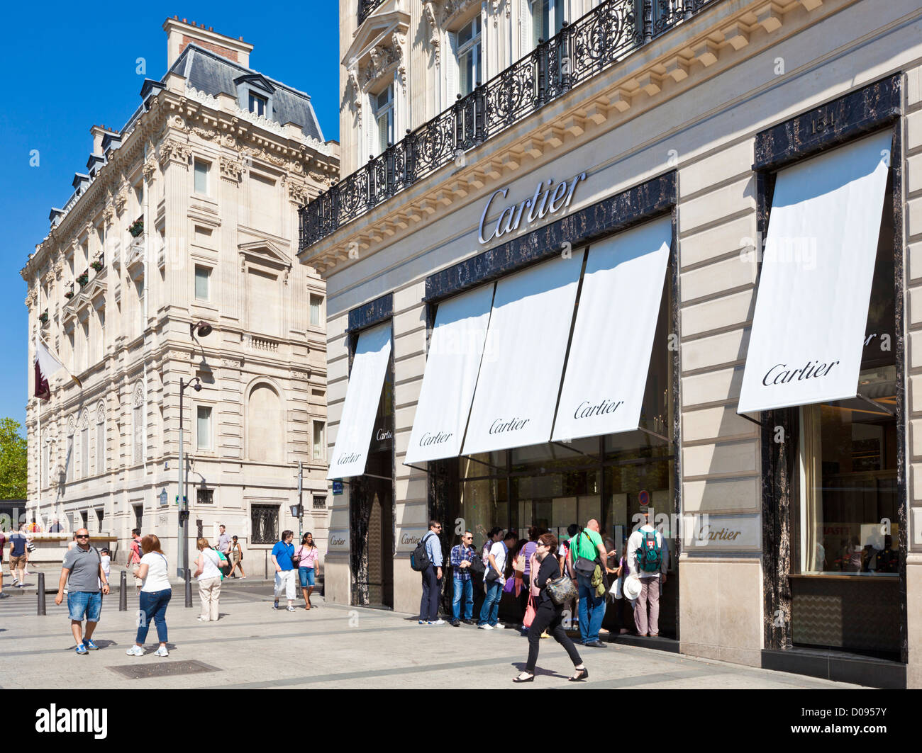 People window shopping at Cartier on the famous shopping street the Avenue des Champs Elysees Paris France EU Europe Stock Photo