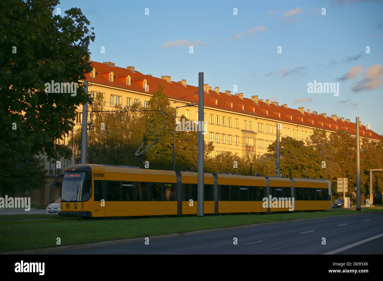 A tram, strassenbahn, and apartment blocks at sunset, Grunauer Strasse, Dresden, Sachsen, Saxony, Germany Stock Photo