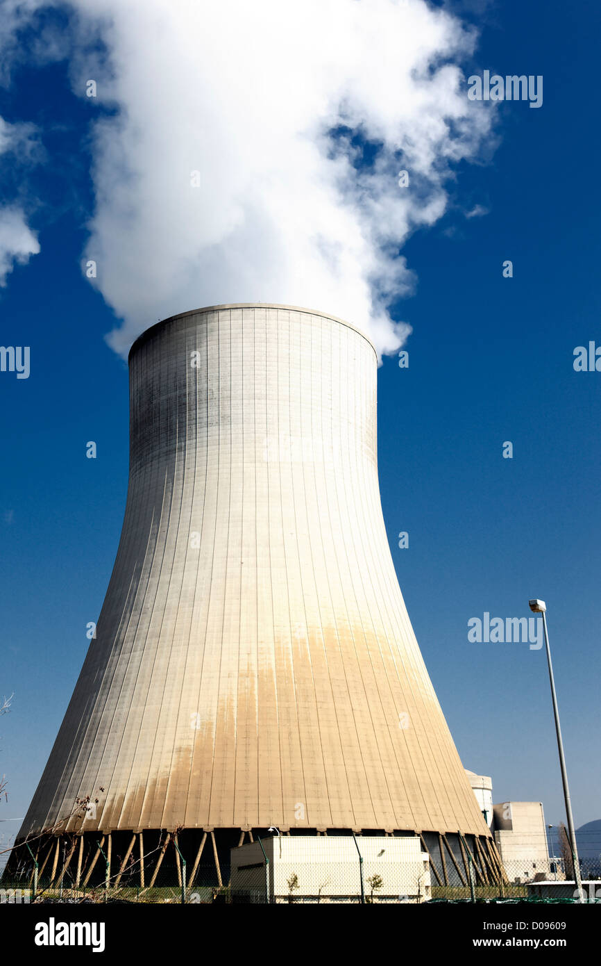 big smokestack of nuclear factory with blue sky Stock Photo