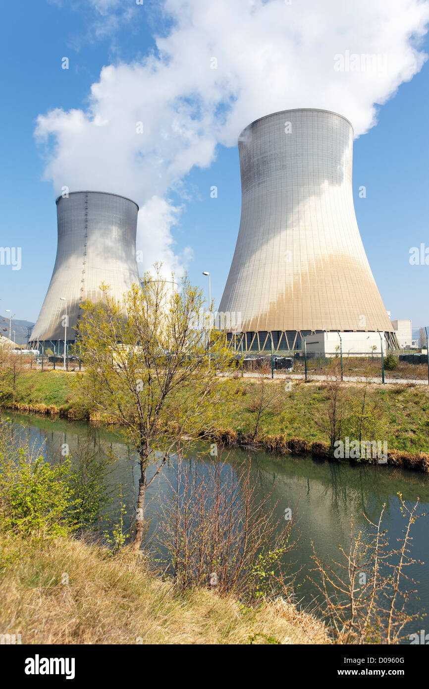 smokestacks of nuclear factory and river in summer Stock Photo