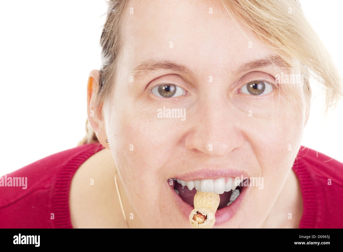 Person eating peanuts Stock Photo Alamy