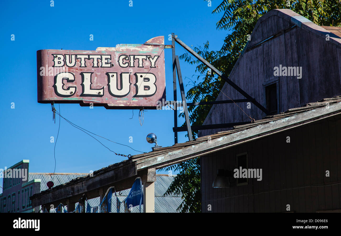 Well weathered old non-working neon sign for Butte City Club hanging off of the front of an old store front in Butte City, Calif Stock Photo