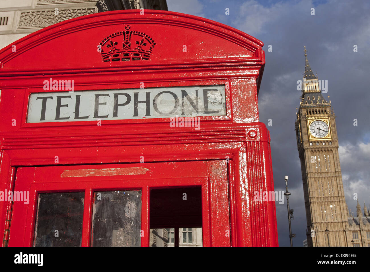 CLOSE-UP OF A LONDON TELEPHONE BOOTH WITH BIG BEN IN THE BACKGROUND LONDON ENGLAND GREAT BRITAIN UNITED KINGDOM Stock Photo