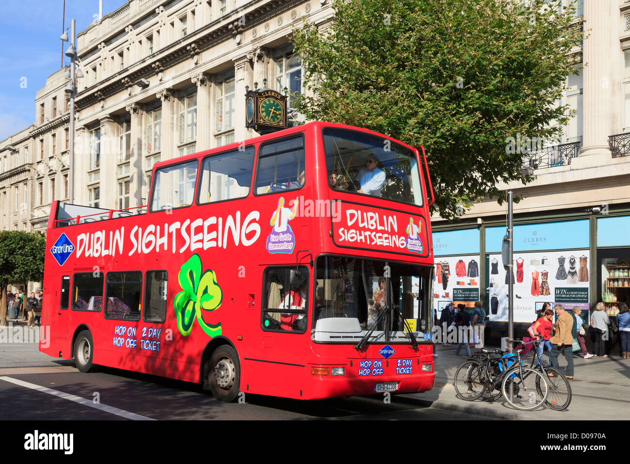 Red open top double decker Hop on Hop off city sightseeing tour bus waiting on O'Connell Street, Dublin, Southern Ireland, Eire Stock Photo