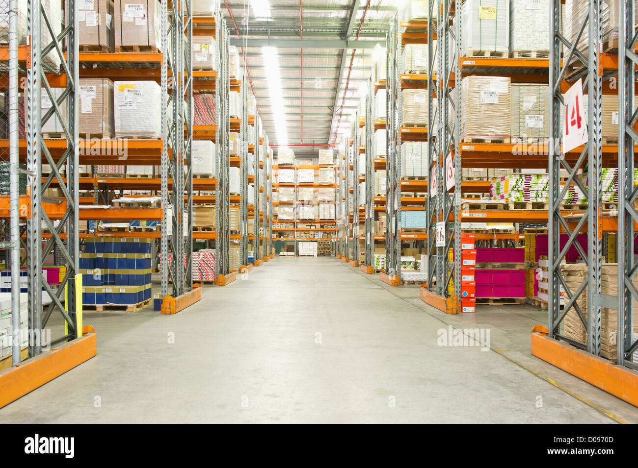 A paper distribution warehouse with stacked shelves Stock Photo Alamy