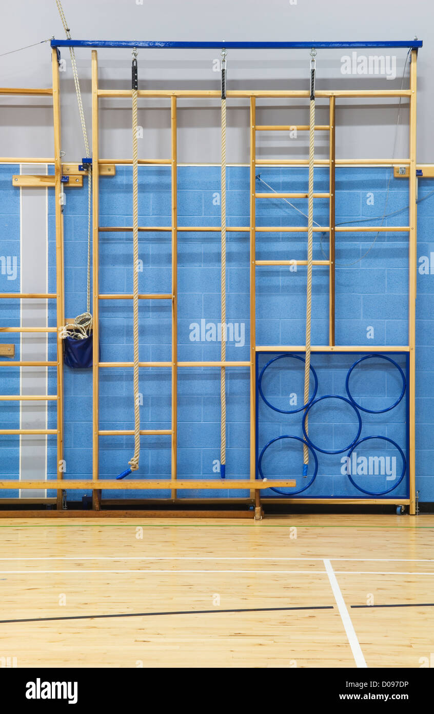 Gymnasium equipment folded away at the side of the sports hall of a