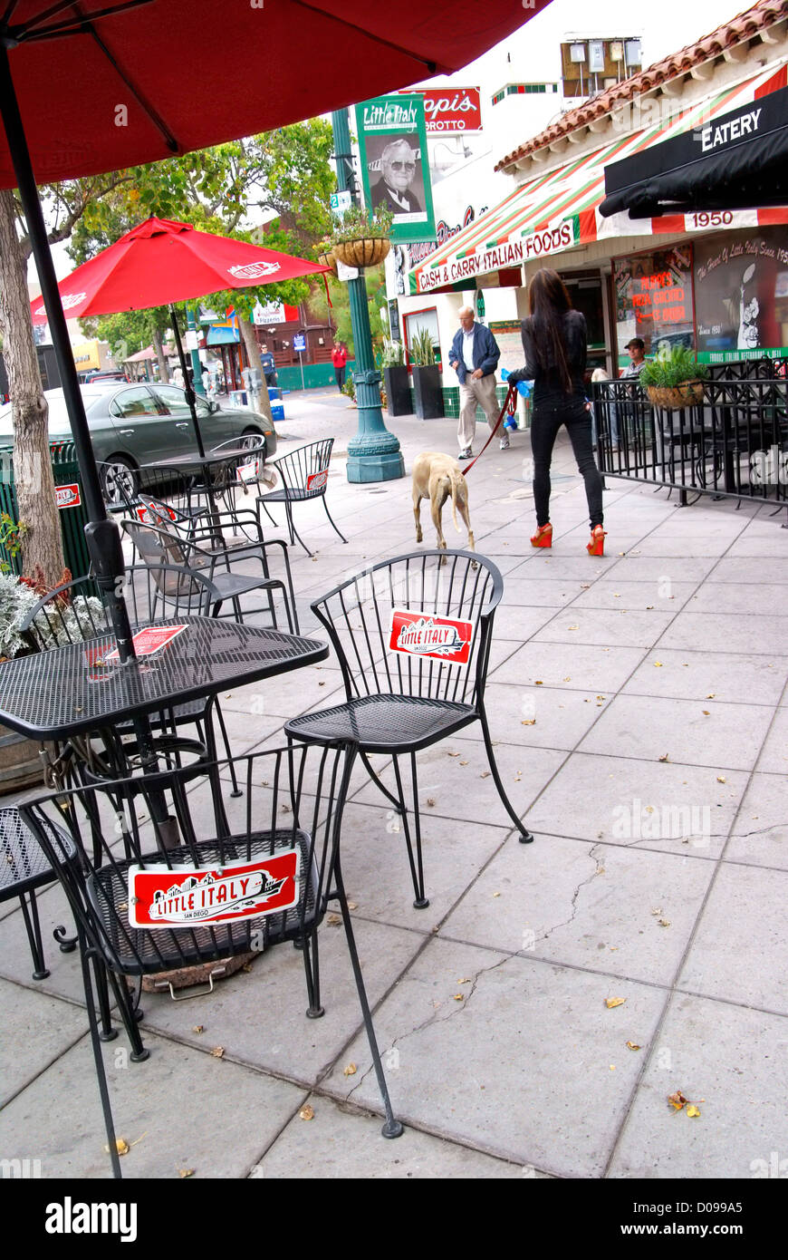 Little Italy, San Diego, USA. Little Italy signs on chairs. People in the street. Stock Photo