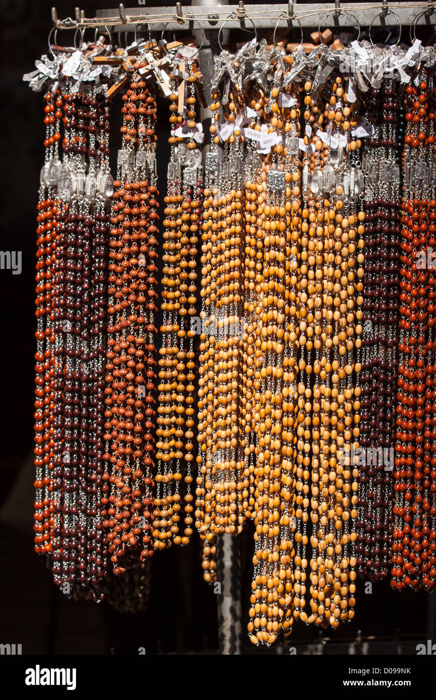 DISPLAY OF ROSARIES AT A RELIGIOUS SOUVENIR SELLER'S SHOP TOWN CENTRE OF LOURDES HAUTES-PYRENEES (65) MIDI-PYRENEES FRANCE Stock Photo