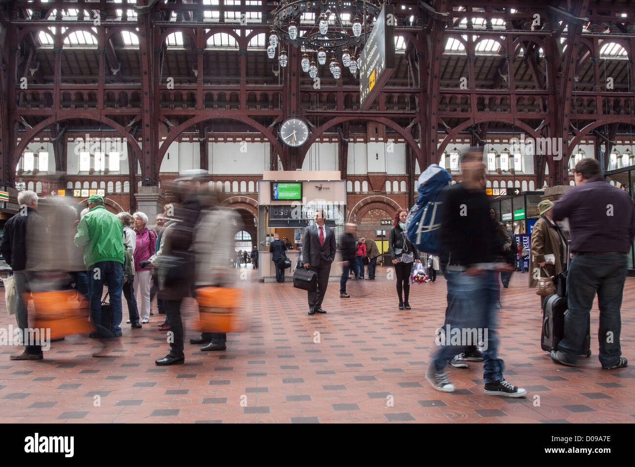 BUSINESSMAN WAITING FOR THE TRAIN IN THE HALL OF THE MAIN TRAIN STATION COPENHAGEN DENMARK EUROPE Stock Photo