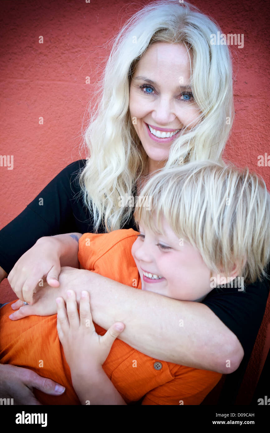 Mother holding Son in her arms Stock Photo - Alamy