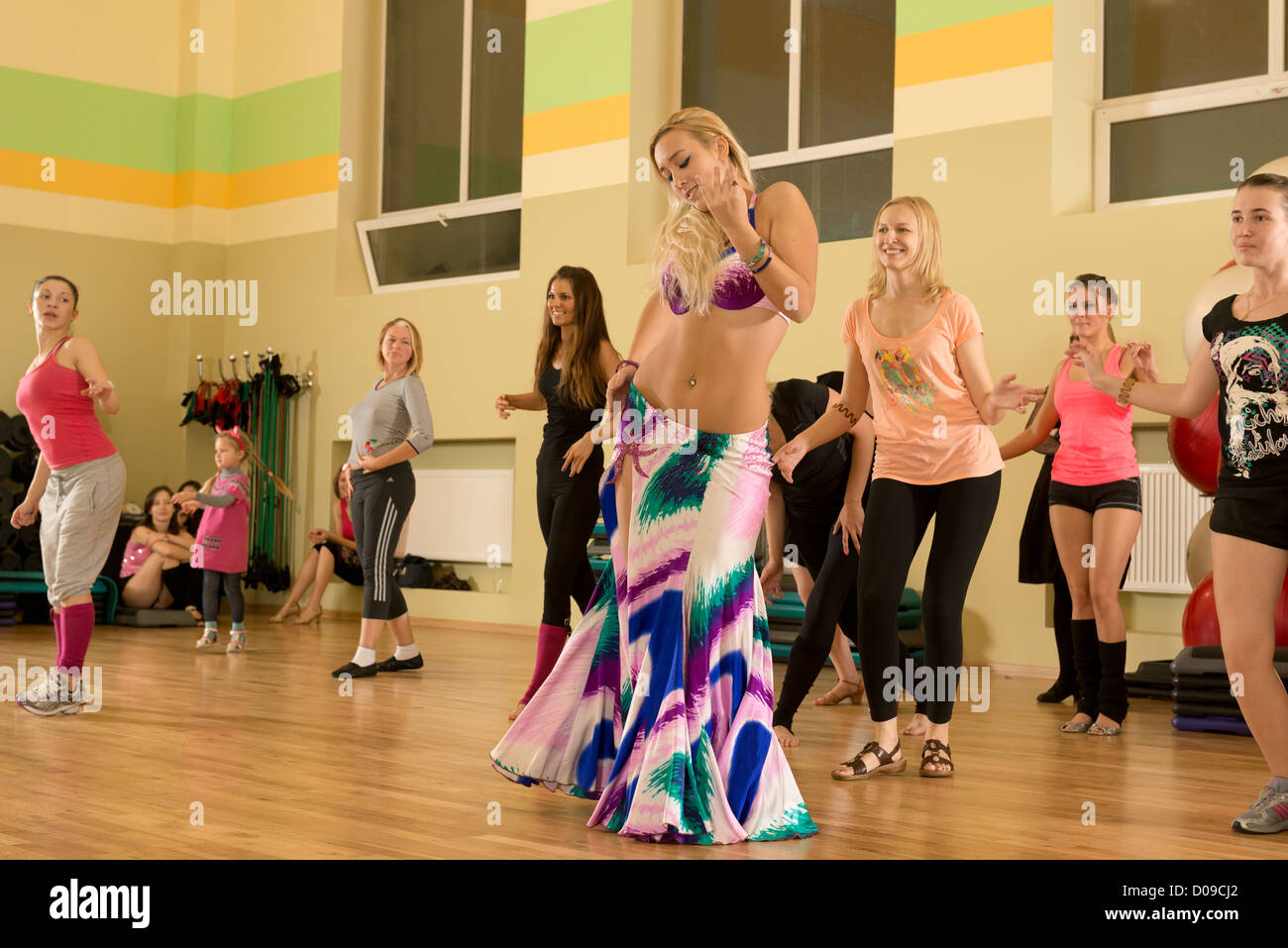 Belly dancer - gorgeous blond with big boobs. Dance competition at the  local fitness club facility Stock Photo - Alamy