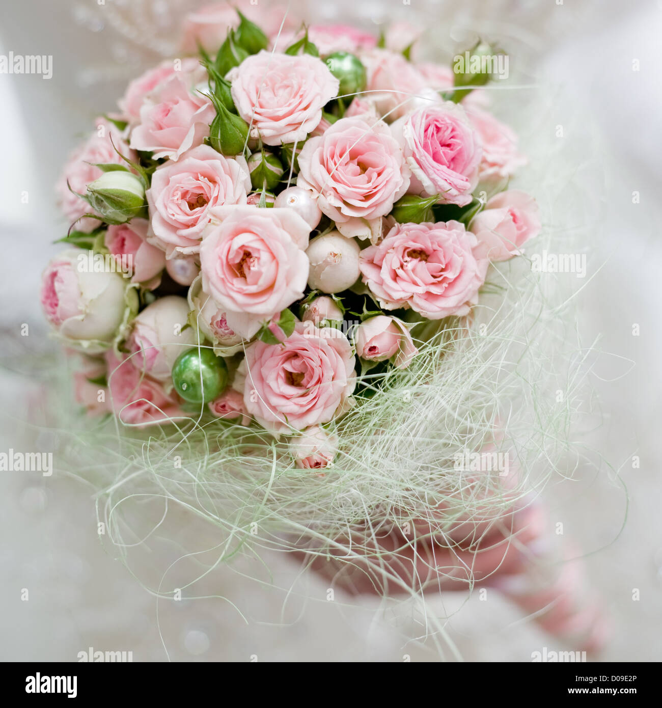 Wedding bouquet with pink roses in bride hand Stock Photo