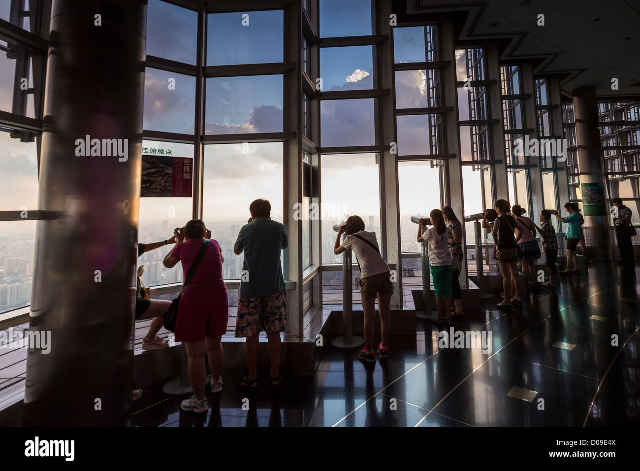 Tourists view the skyline from the Jin Mao Tower Skywalk indoor observation  deck Shanghai, China Stock Photo - Alamy