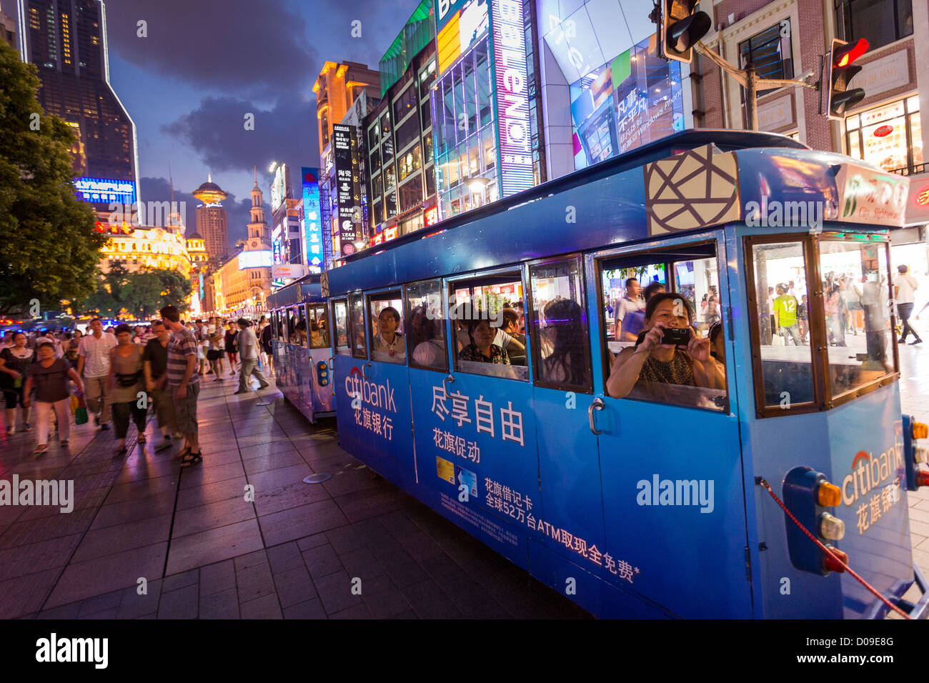 People shop on Nanjing East Road in Shanghai, China. Stock Photo