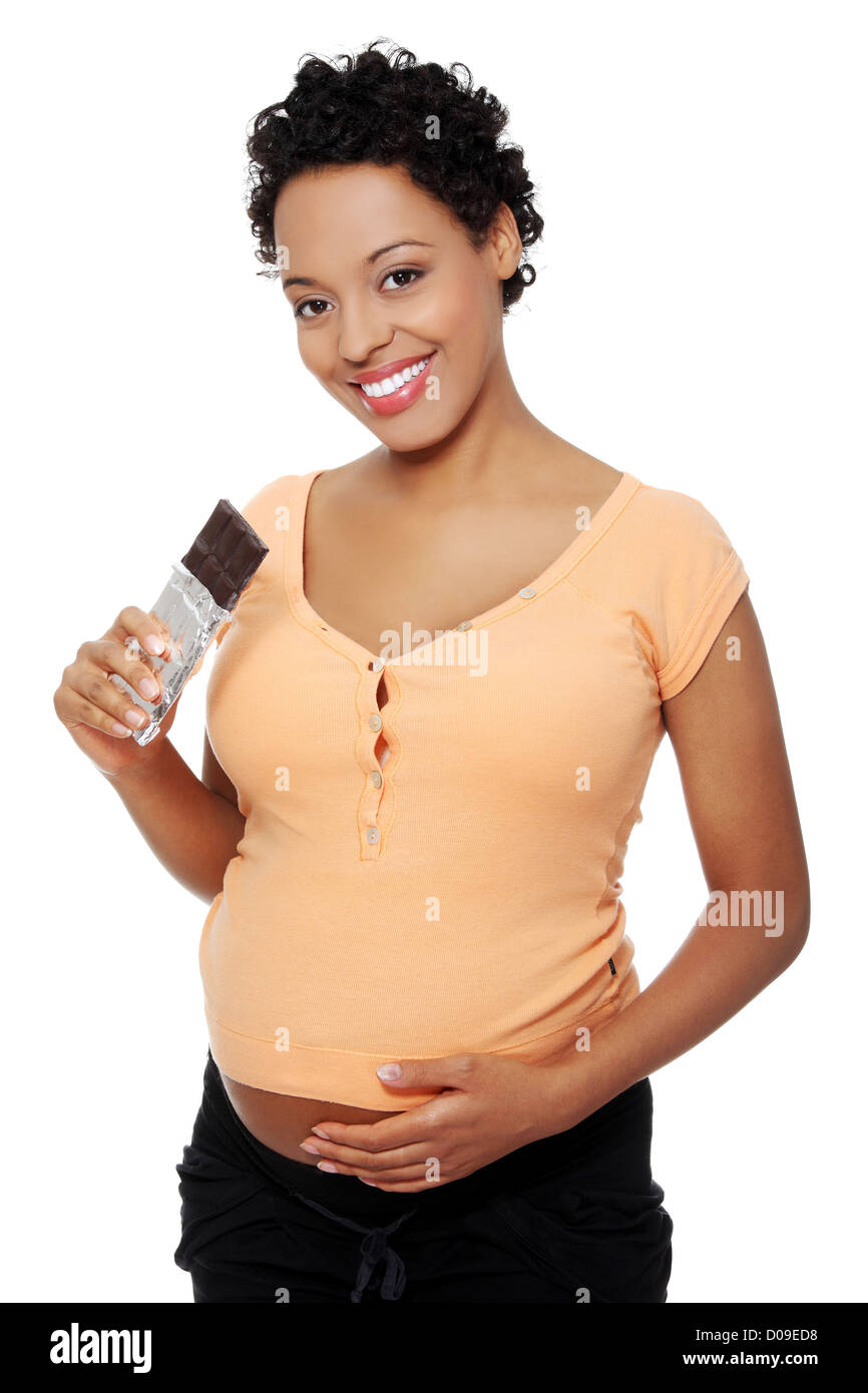 Pregnant woman eating chocolate Stock Photo Alamy