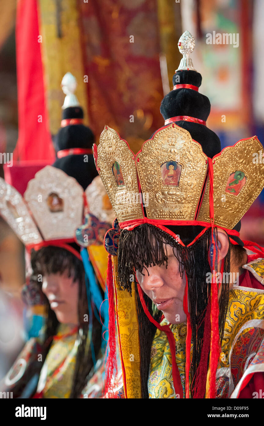 Wearing ceremonial head wear and vestments, Buddhist nuns ring bells and  chant at Anezamkang Nunnery, Lhasa, Tibet, China Stock Photo - Alamy